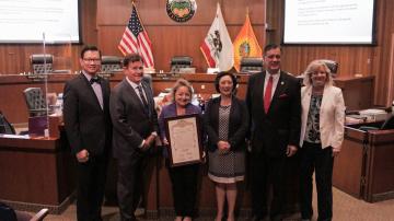 The Orange County Board of Supervisors hold a document proclaiming November Adoption Awareness Month in Orange County